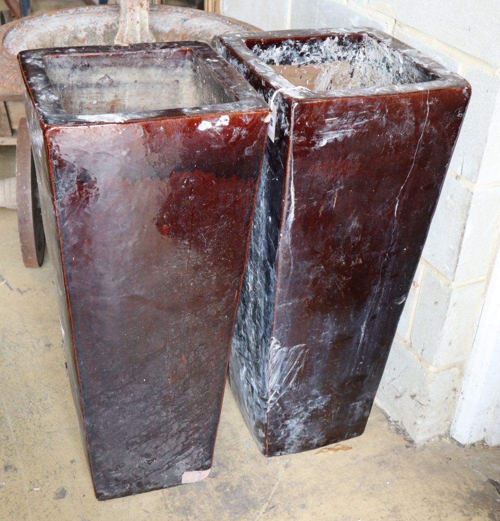 A pair of tall brown glazed earthenware garden planters, H.90cm